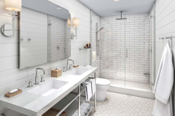 A modern bathroom features a double vanity, mirrors, a glass-enclosed shower, white tiles, towels, and minimalist fixtures.