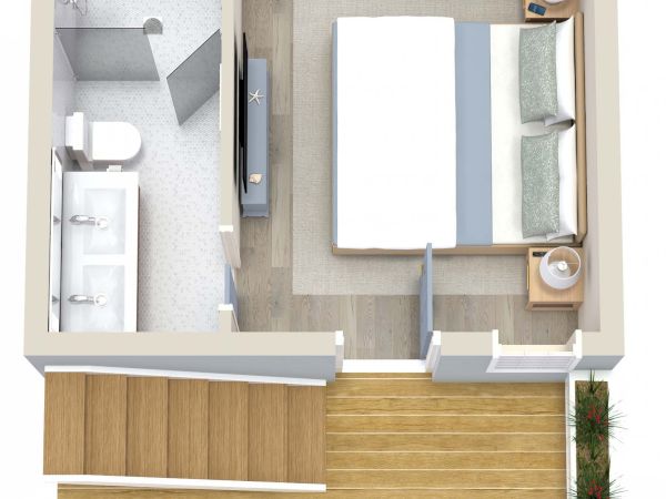 This image shows a floor plan with a bedroom, attached bathroom, a small desk area, and an outdoor terrace with seating.