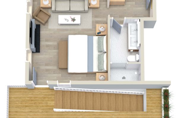 This is a floor plan of a one-bedroom apartment with a living area, kitchen, bathroom, bedroom, and a balcony.