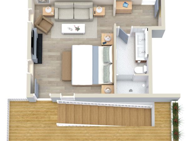 This is a floor plan of a one-bedroom apartment with a living area, kitchen, bathroom, bedroom, and a balcony.